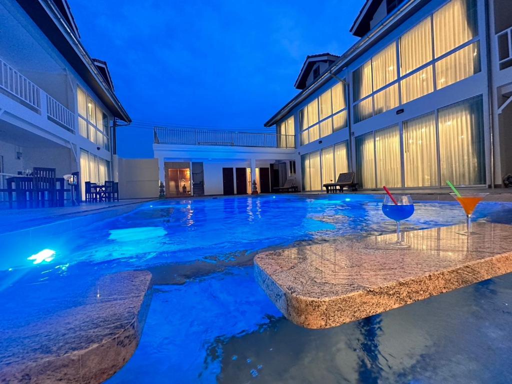 a swimming pool in the middle of a building at Pratamnak Residence Luxury Villas in Pattaya South