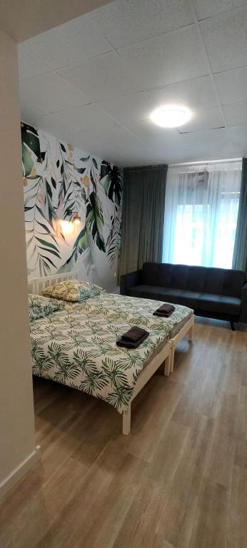 Posteľ alebo postele v izbe v ubytovaní Apartamenty Częstochowa