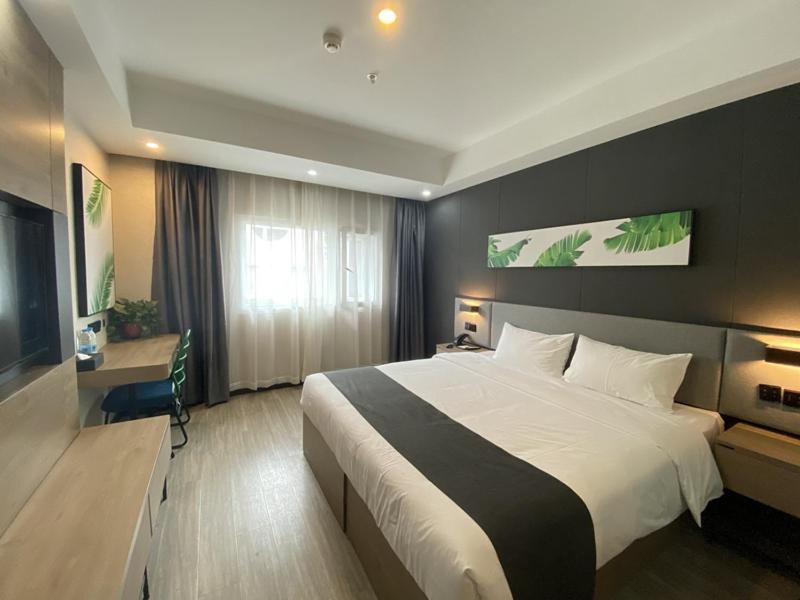 Ліжко або ліжка в номері Thank Inn Plus Taian Dongping Xishan Road