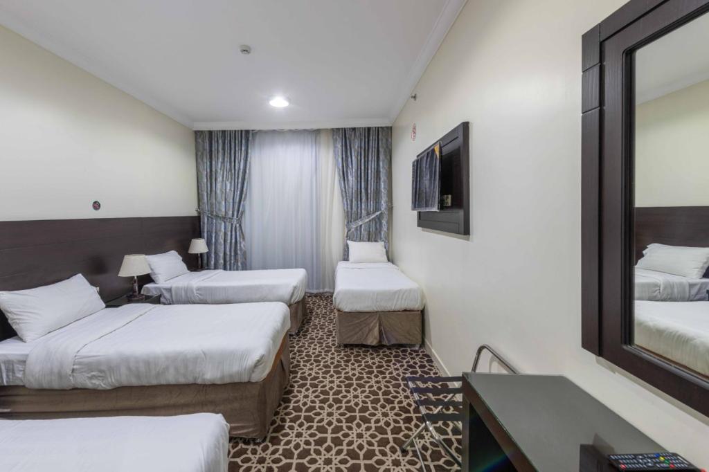 Postel nebo postele na pokoji v ubytování Abdul Hafez Al Humaidan Hotel