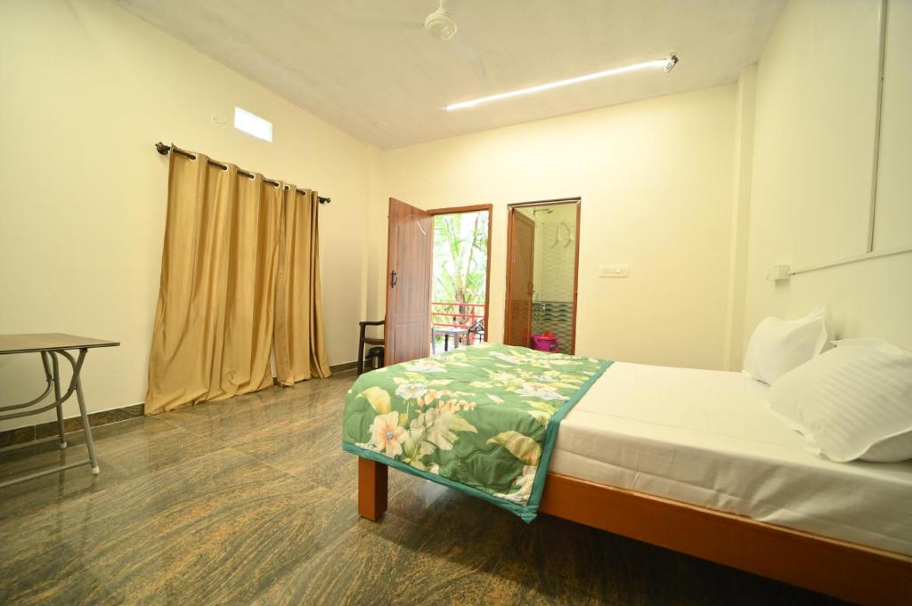 Postel nebo postele na pokoji v ubytování Coorg HomeStay Resort