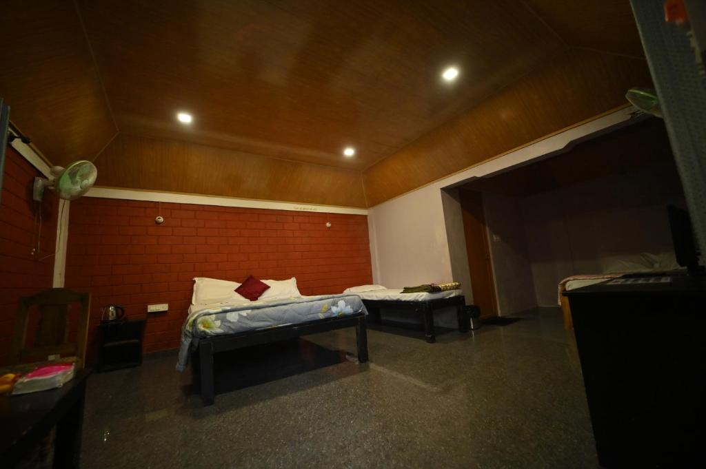 Postel nebo postele na pokoji v ubytování Coorg HomeStay Resort