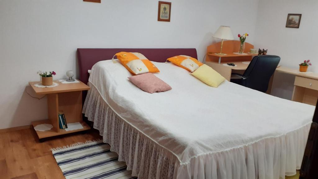 Postel nebo postele na pokoji v ubytování Berta Apartman