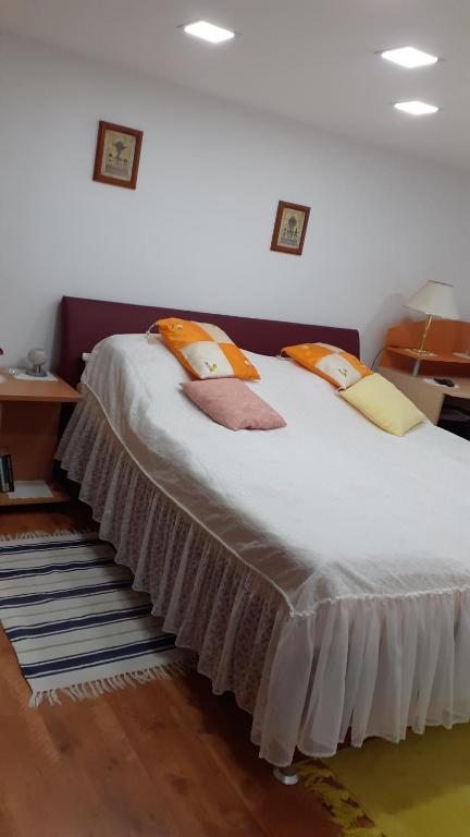 Postel nebo postele na pokoji v ubytování Berta Apartman