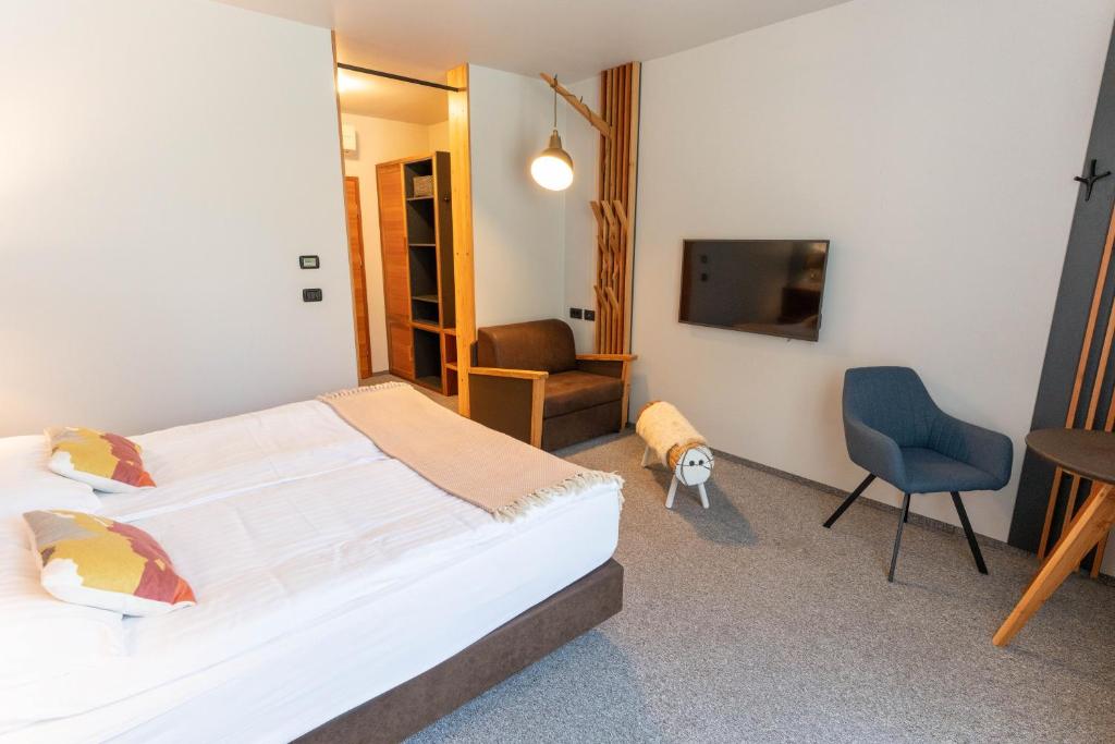 Postel nebo postele na pokoji v ubytování Hotel Boka