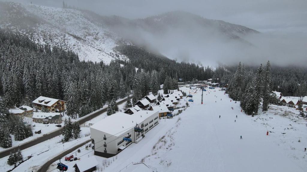 an aerial view of a ski resort in the snow at YOLOJ sk - Garage parking - Ski in Ski Out in Belá