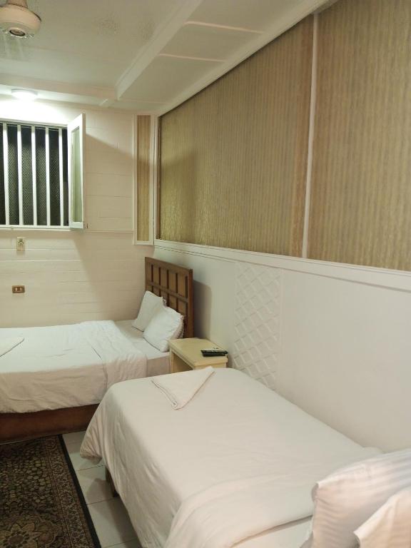 Postel nebo postele na pokoji v ubytování Hotel Panorama