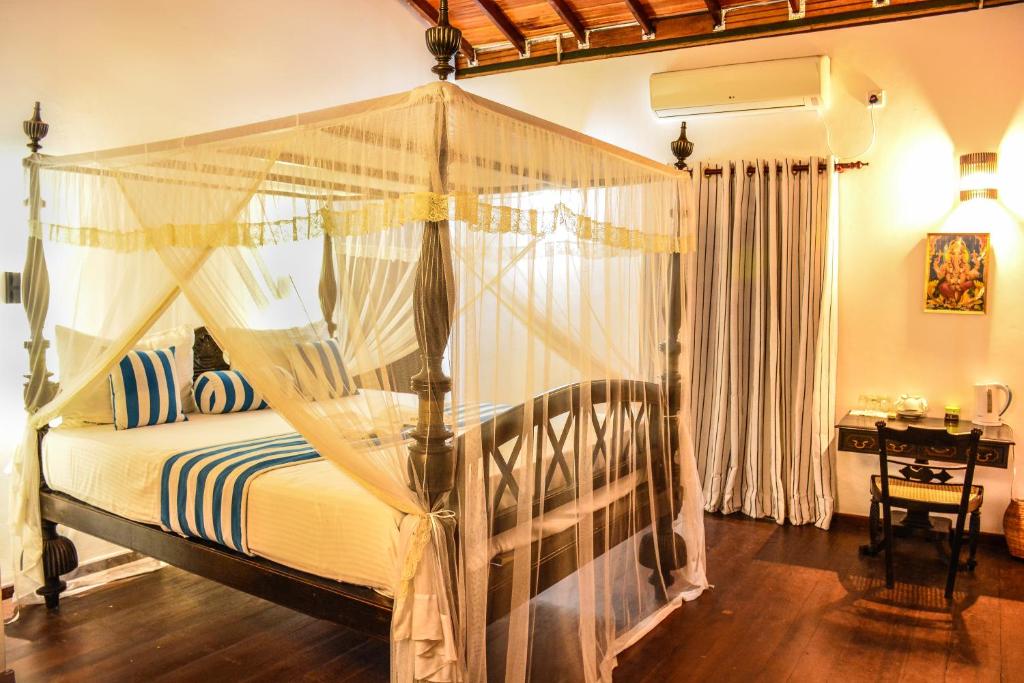 Postel nebo postele na pokoji v ubytování Araliya Gardens Hotel