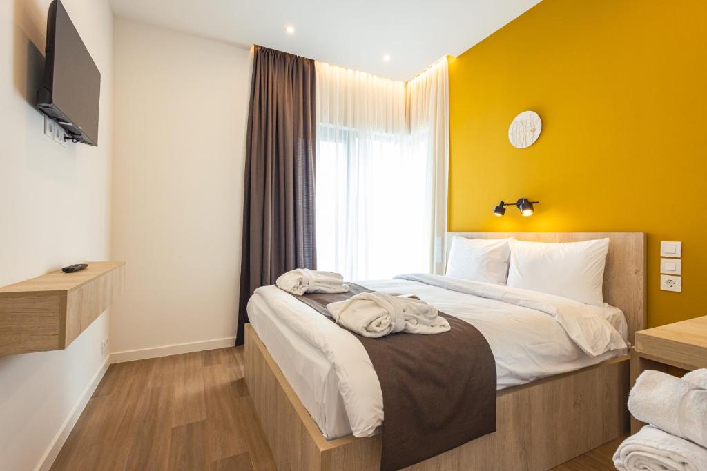 Postel nebo postele na pokoji v ubytování Apart Hotel Kundzuli