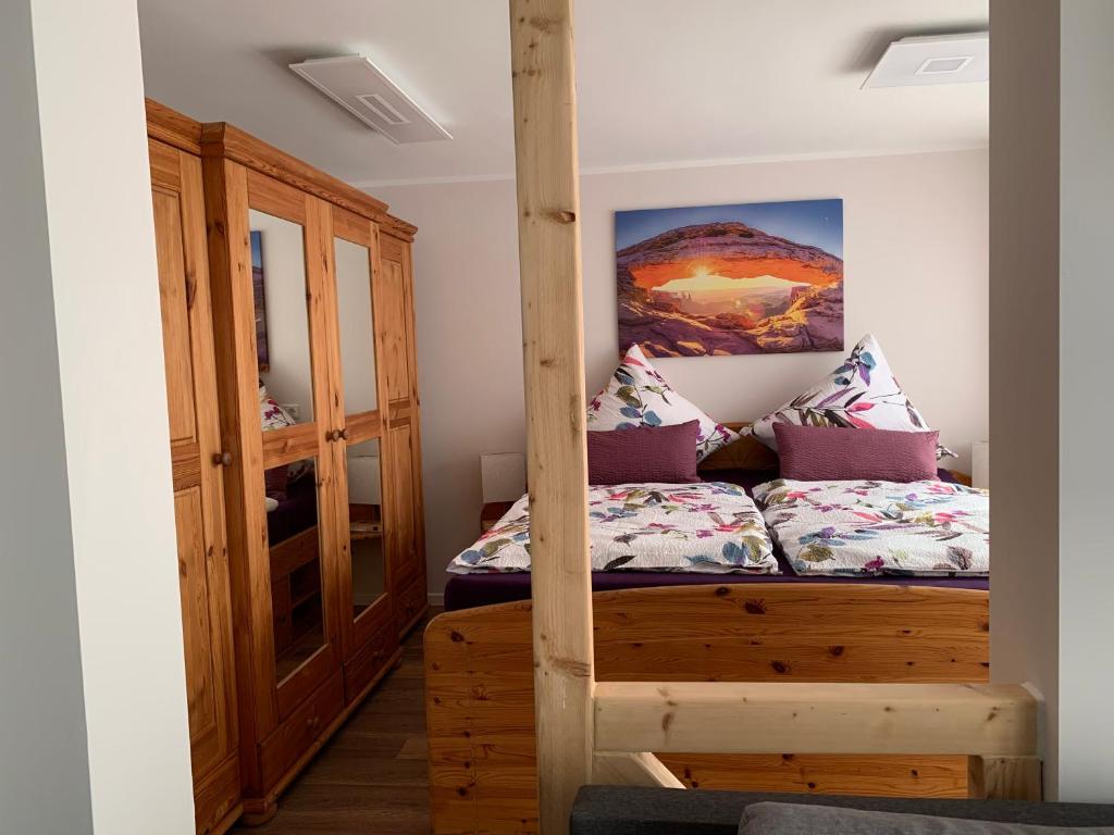 a bedroom with a bunk bed in a room at Ferienwohnung (T)raumland in Bad Berleburg