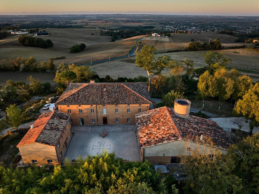 an aerial view of a building with red tile roofs at Les Bastides de Roquemaure 
