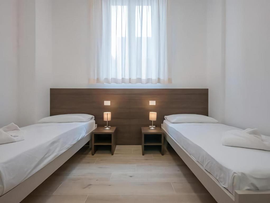 Voodi või voodid majutusasutuse Casa Sforza toas