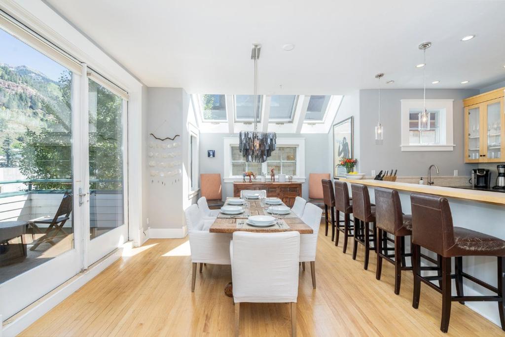 a kitchen and dining room with a table and chairs at East Side Hideaway in Telluride
