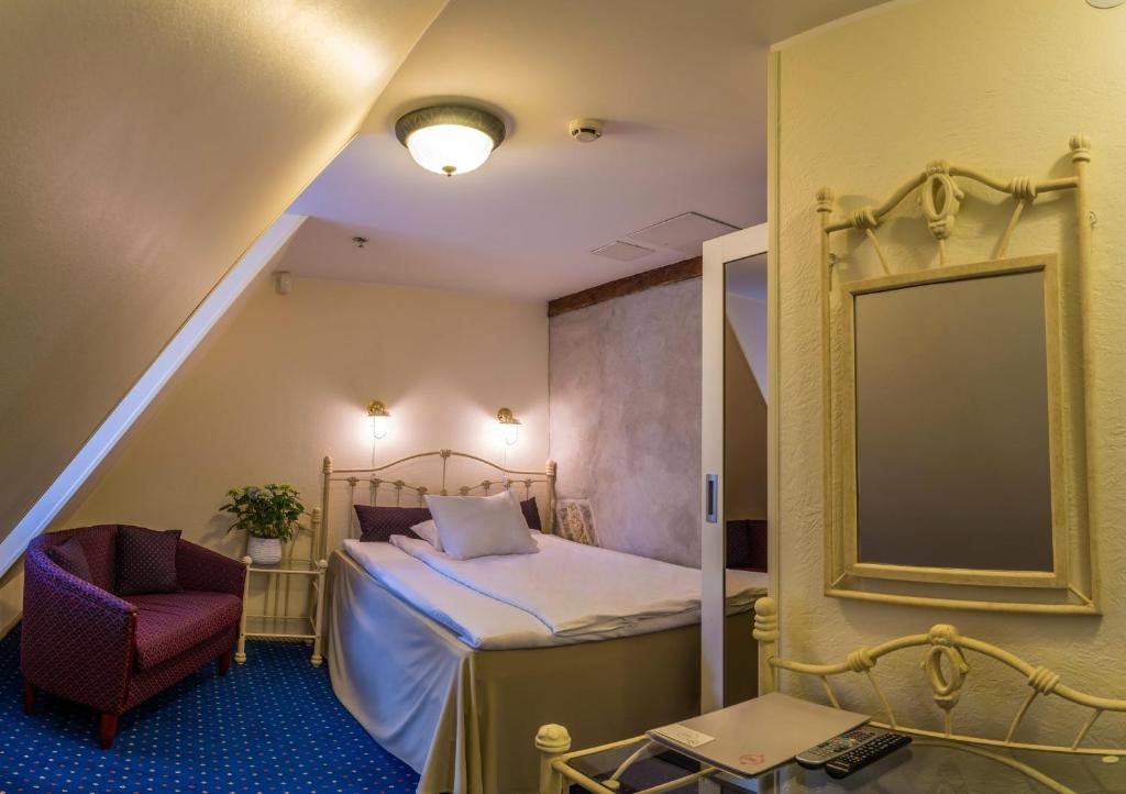 Postel nebo postele na pokoji v ubytování CRU Hotel