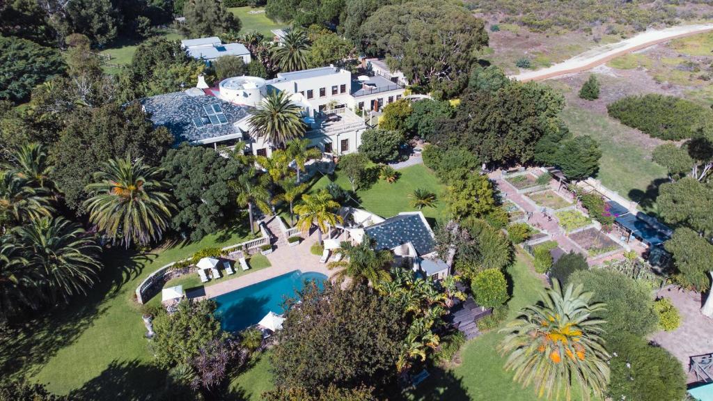 an aerial view of a mansion with a swimming pool at Ibis House in Cape Town