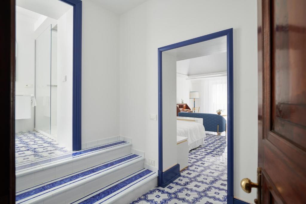 Posteľ alebo postele v izbe v ubytovaní Hotel Scalinatella