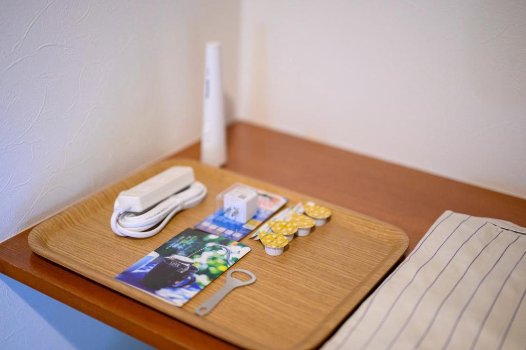 Postel nebo postele na pokoji v ubytování ゲストハウス小布施