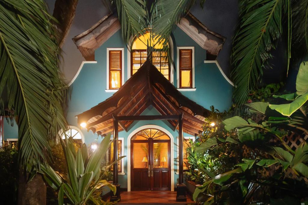 a house with a roof with plants in front of it at Villa C'est La Vie in Rodney Bay Village