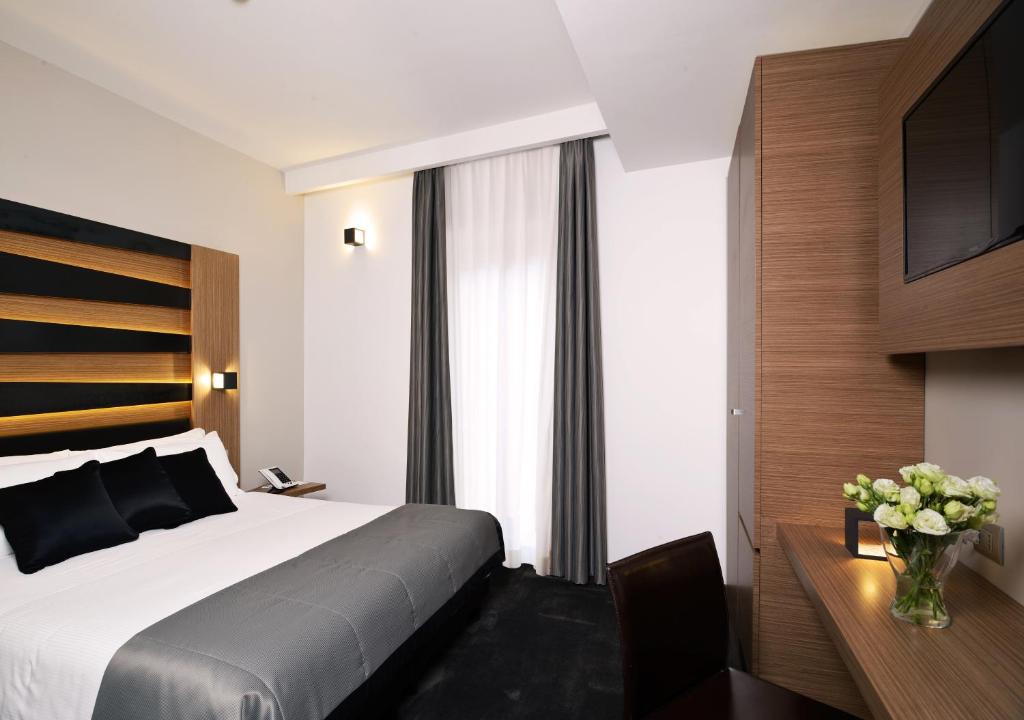 Postel nebo postele na pokoji v ubytování Hotel Trevi - Gruppo Trevi Hotels