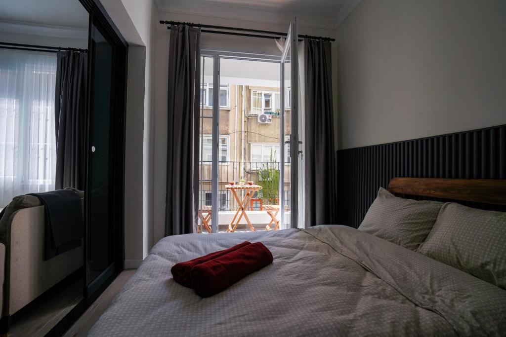 Postel nebo postele na pokoji v ubytování Merkuri apartments