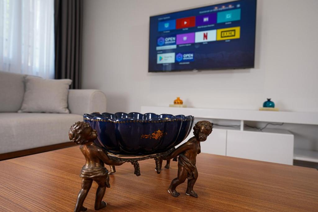 TV a/nebo společenská místnost v ubytování Merkuri apartments