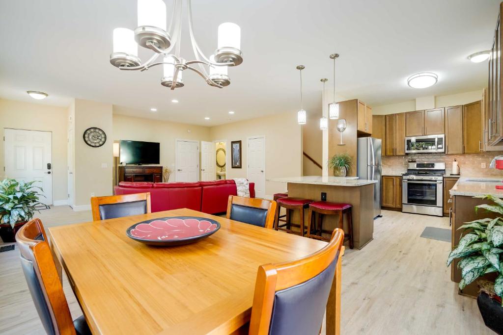 a dining room and kitchen with a table and chairs at Anchorage Retreat Charming Home with Private Deck! in Anchorage