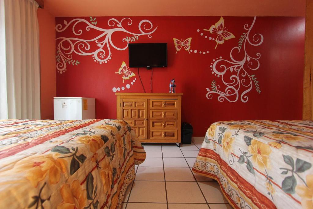 Postel nebo postele na pokoji v ubytování Hotel Real de la Sierra