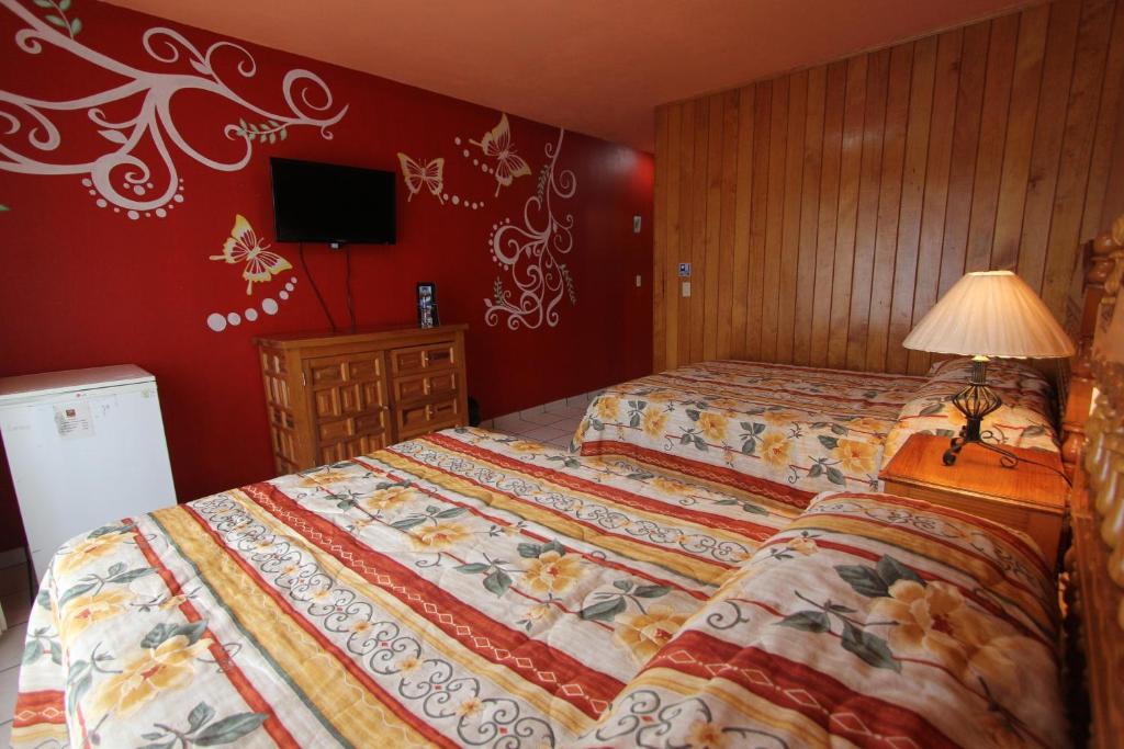 Postel nebo postele na pokoji v ubytování Hotel Real de la Sierra
