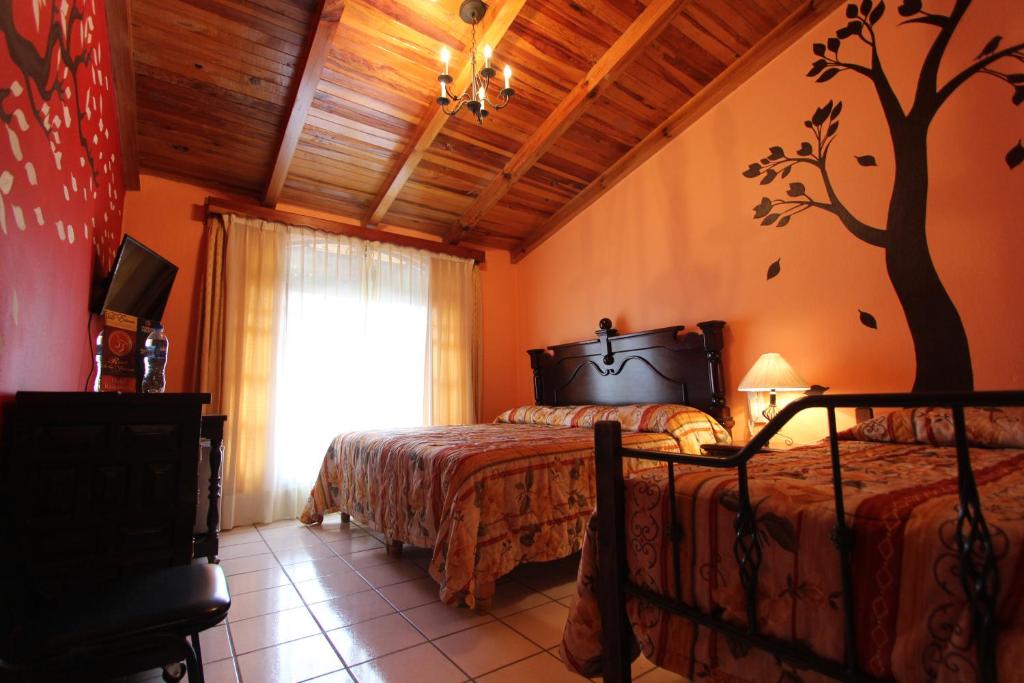 Postel nebo postele na pokoji v ubytování Hotel Real de la Sierra