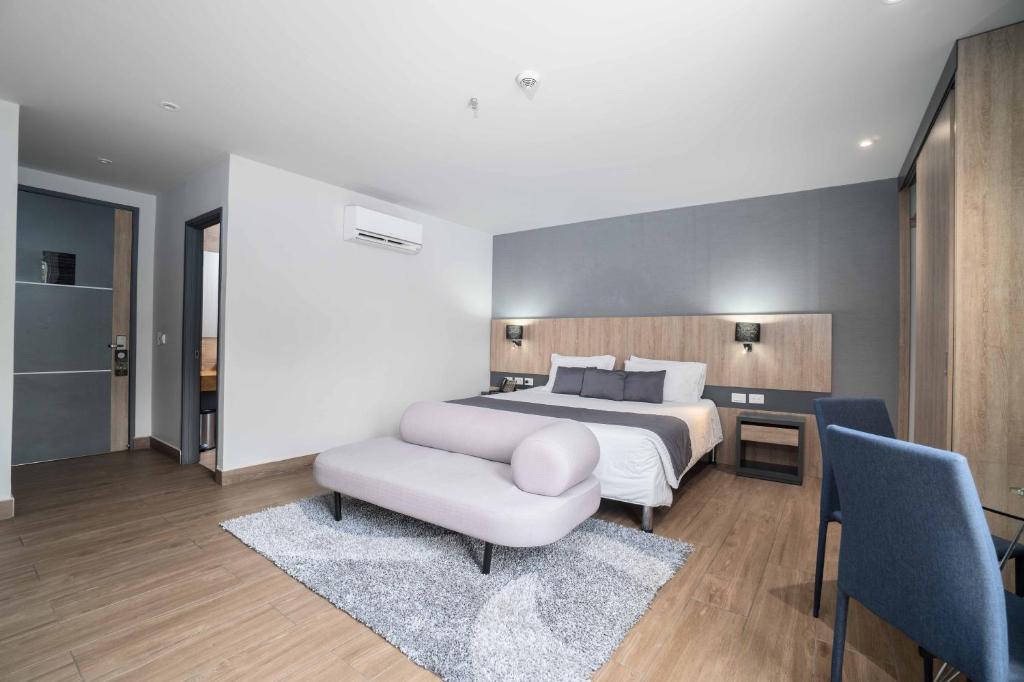 Giường trong phòng chung tại Hotel Plaza del Lili