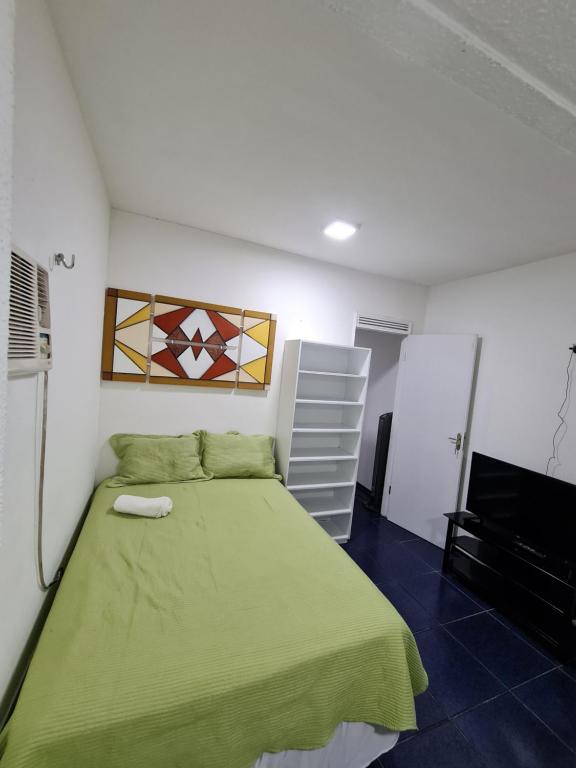 En eller flere senge i et værelse på Apartamento na Praia de Iracema, Meireles.