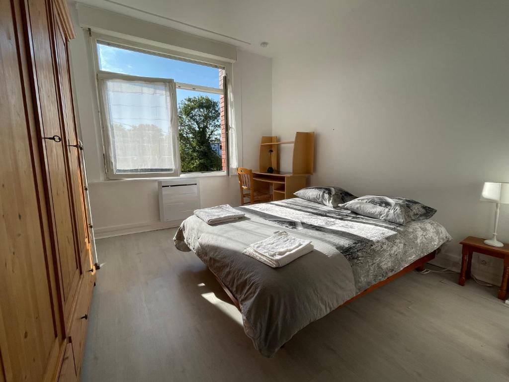 Ένα ή περισσότερα κρεβάτια σε δωμάτιο στο Appartement calme et lumineux