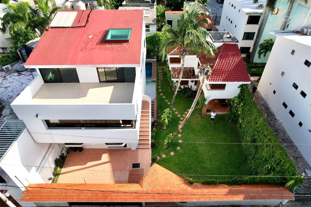 an aerial view of a house with a yard at Beautiful Jungle House on a strategic location in Cancún