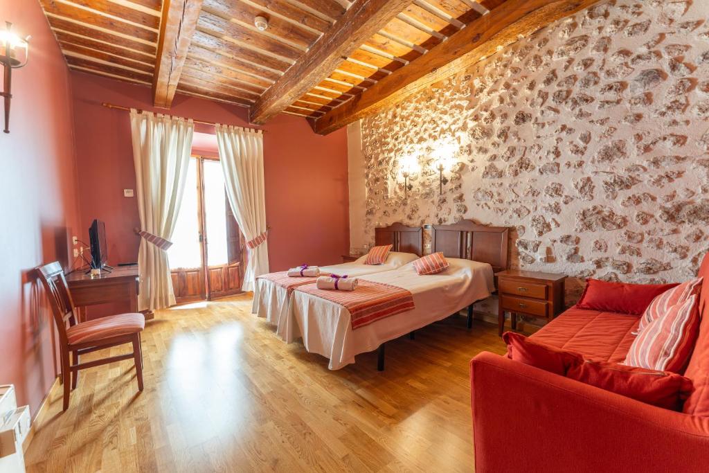 Postel nebo postele na pokoji v ubytování Hotel Rincón Castellano