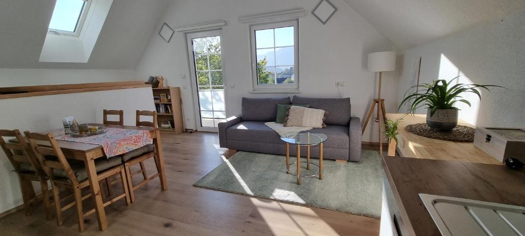 a living room with a couch and a table at Ferienwohnung in Mariahof in Neumarkt in Steiermark