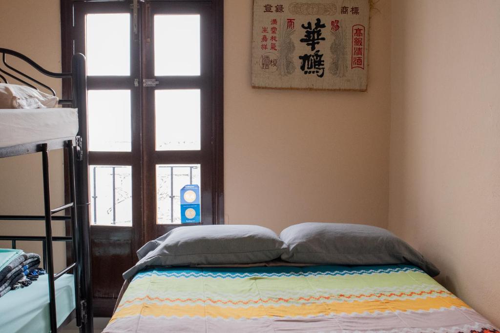 Postel nebo postele na pokoji v ubytování Hostal Encounter Guanajuato