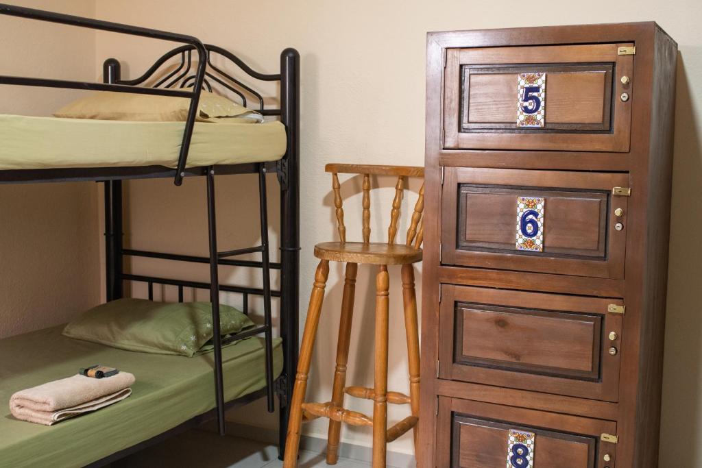 Postel nebo postele na pokoji v ubytování Hostal Encounter Guanajuato