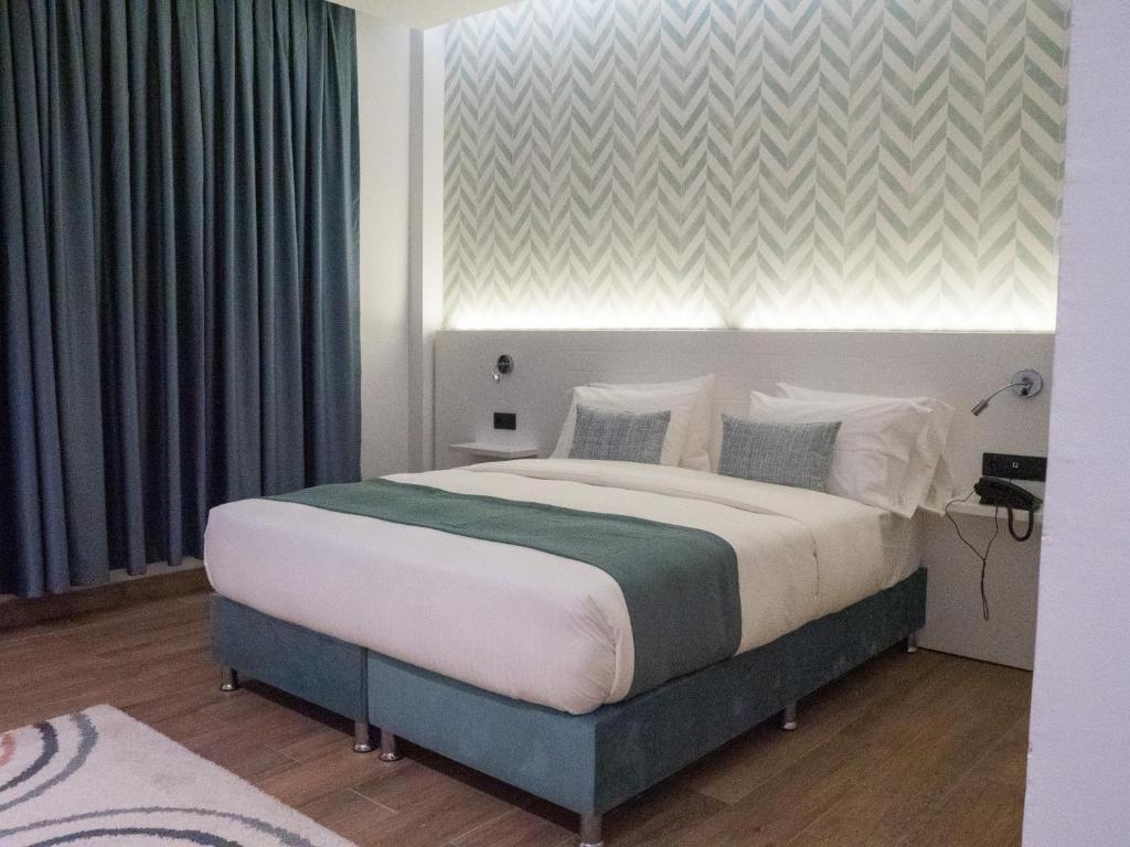 Postel nebo postele na pokoji v ubytování HOTEL HIBA