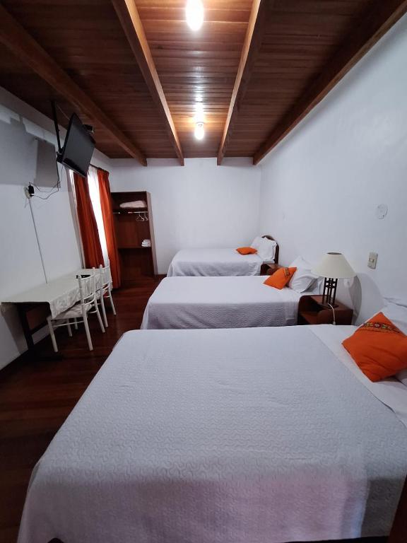 Postel nebo postele na pokoji v ubytování Casa Wayra Cajamarca