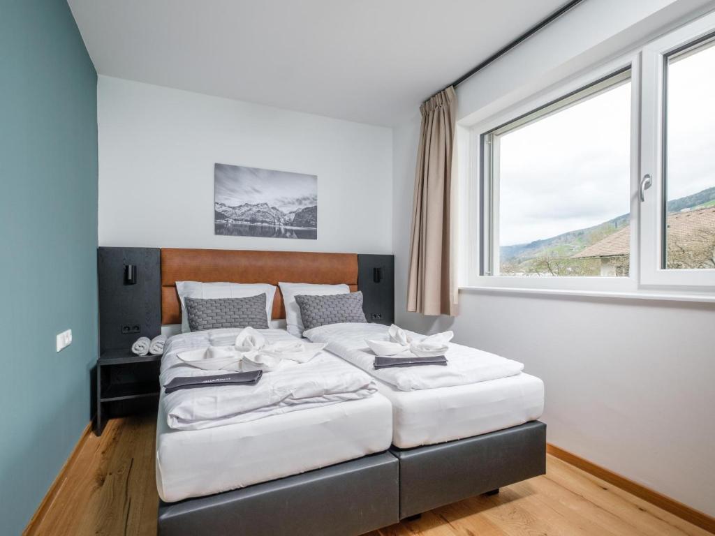 Postel nebo postele na pokoji v ubytování Aquarius Haus 7 TOP 16