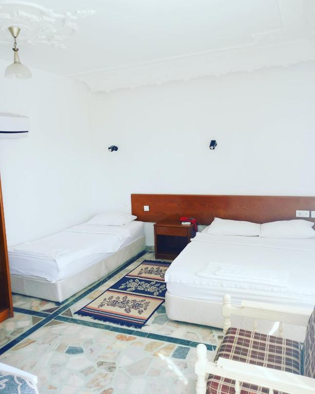 Postel nebo postele na pokoji v ubytování Hotel Anadolu