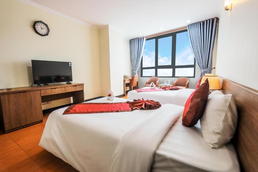 Postel nebo postele na pokoji v ubytování T.26 Hotel