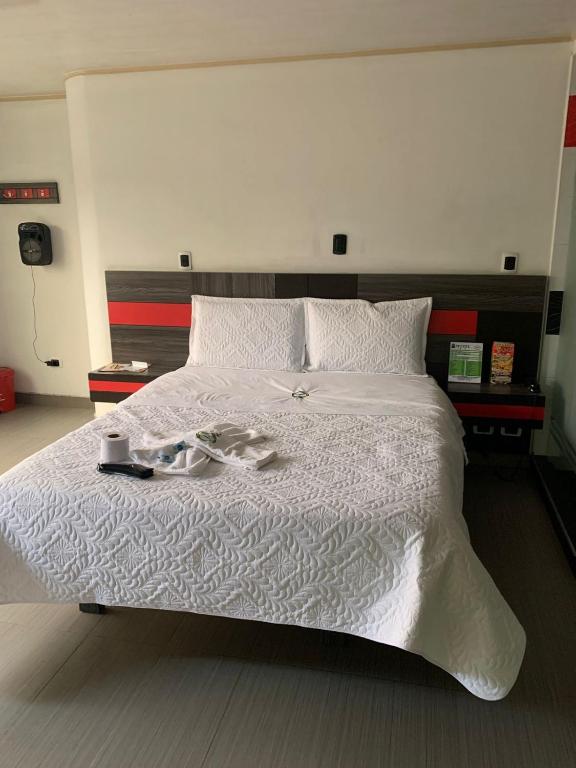 Postel nebo postele na pokoji v ubytování Hotel Planeta 3