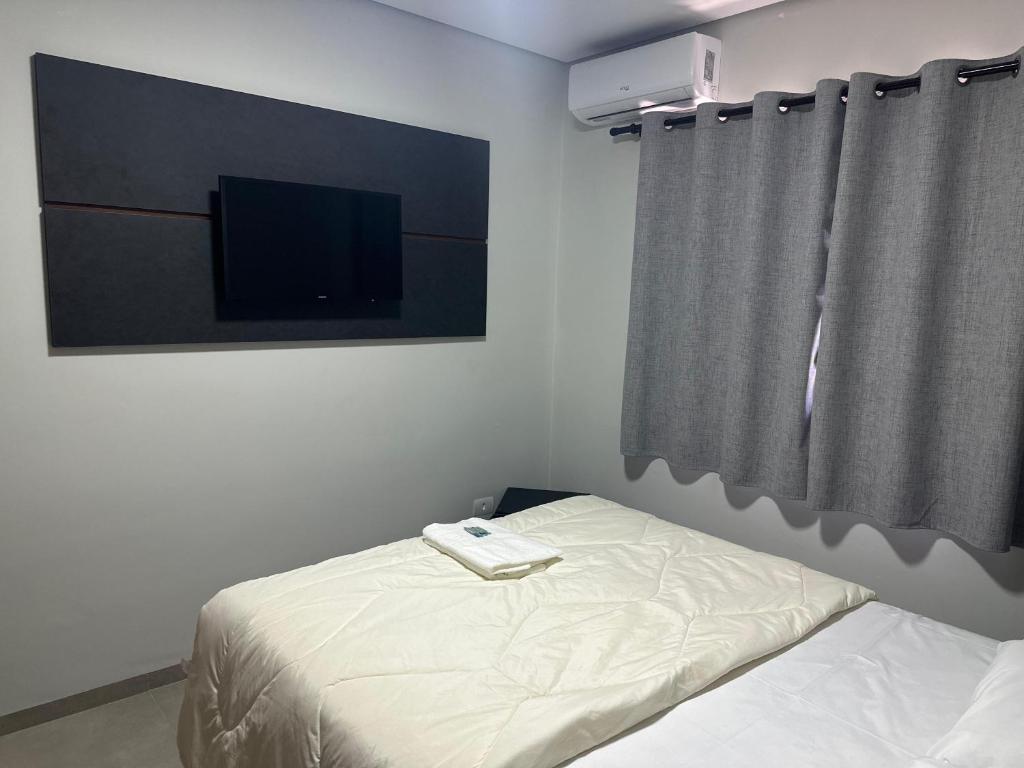 Postel nebo postele na pokoji v ubytování Hotel 7 Quedas