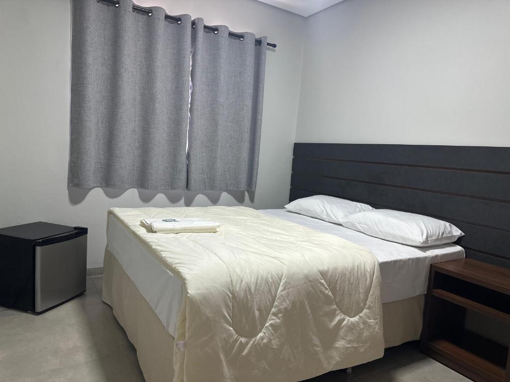 Postel nebo postele na pokoji v ubytování Hotel 7 Quedas