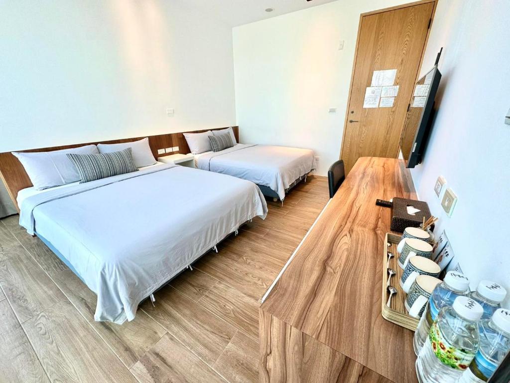 Postel nebo postele na pokoji v ubytování Galilee B&B 加利利海民宿