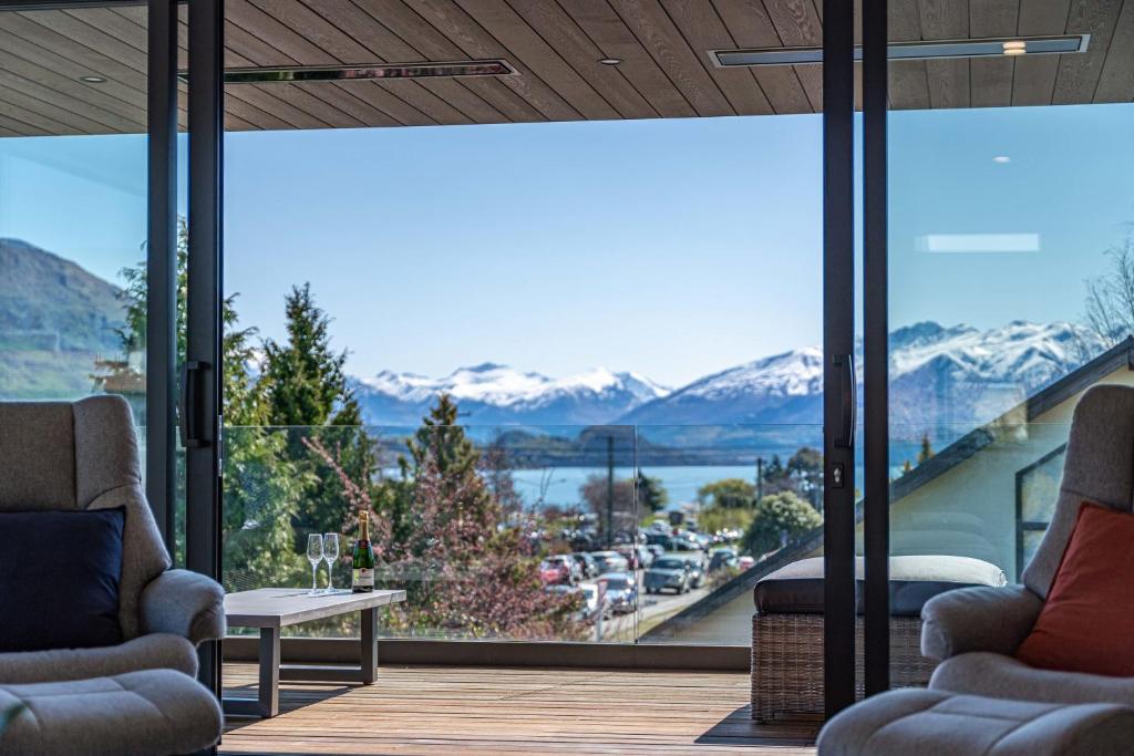 a house with a view of the mountains at Central Vista in Wanaka in Wanaka