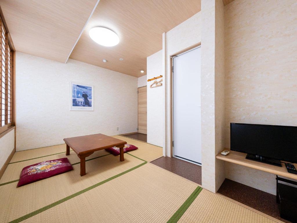 TV a/nebo společenská místnost v ubytování Fuji Sakura Onsen Ryokan