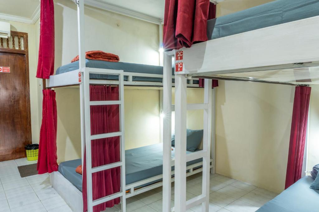 Postel nebo postele na pokoji v ubytování Maharani Hostel