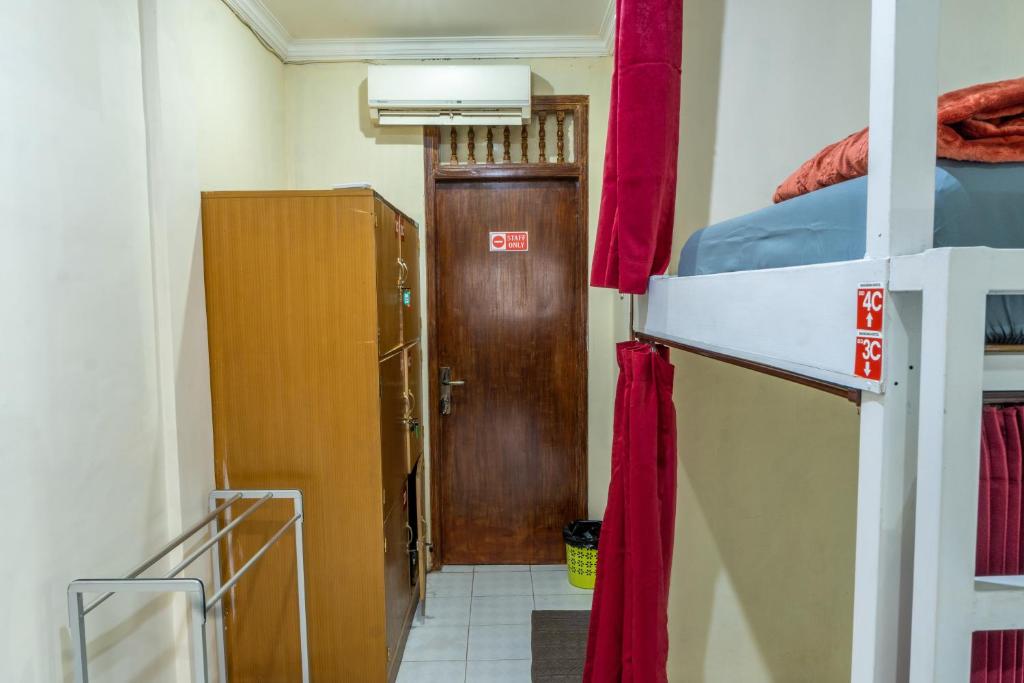 Postel nebo postele na pokoji v ubytování Maharani Hostel